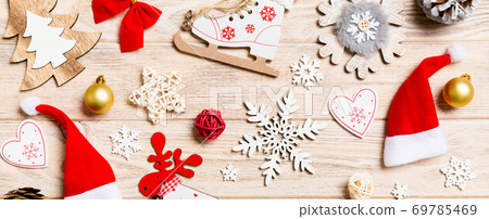 Top view Banner of Christmas toys on wooden background. New Year ornament. Holiday concept 69785469