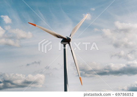 A white Windmill against a blue sky. Windmill in nature A white Windmill against a blue sky. Windmill in nature 69786852