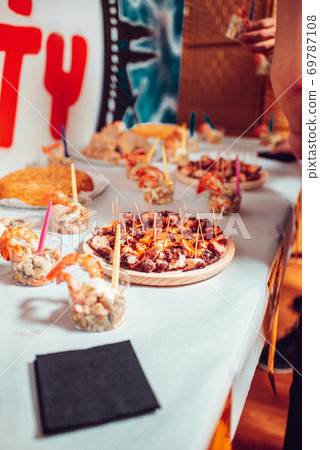 Table full of food at a party in Galicia Table full of food at a party in Galicia 69787108