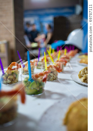 Table full of food at a party Table full of food at a party 69787111