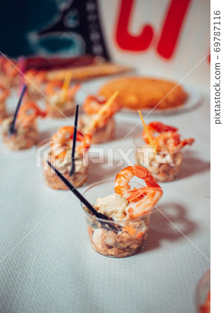 Table full of food at a party Table full of food at a party 69787116