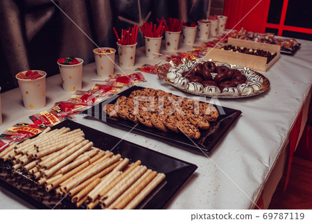 Table of sweets on a birthday party Table of sweets on a birthday party 69787119