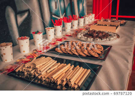 Table of sweets on a birthday party Table of sweets on a birthday party 69787120