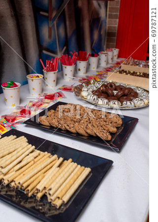 Table of sweets on a birthday party Table of sweets on a birthday party 69787121