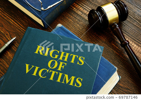 Rights of victims book on wooden surface. 69787146