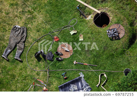 Professional instruments for plumber on Green Grass background top view Professional instruments for plumber on Green Grass background top view 69787255
