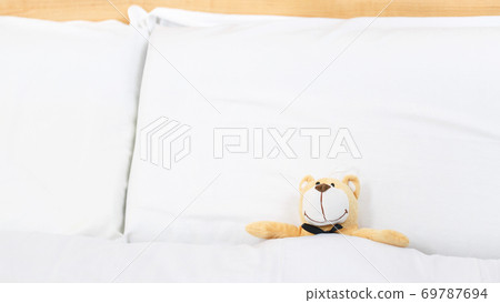 teddy bear on an empty clean bed teddy bear on an empty clean bed 69787694