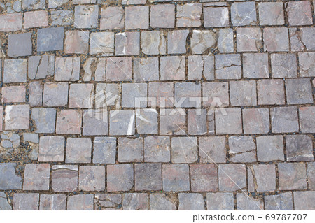 Texture of old broken stone paving stones 69787707