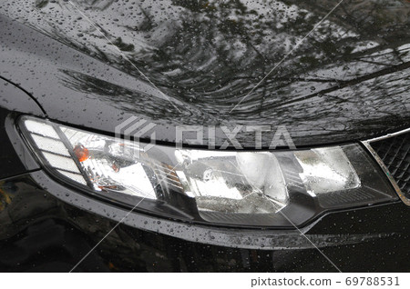 Head Lamp Of Black Car 69788531