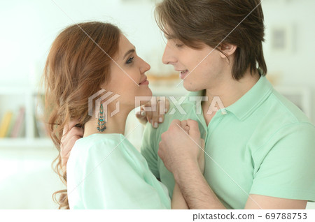Portrait of happy young couple in love Portrait of happy young couple in love 69788753