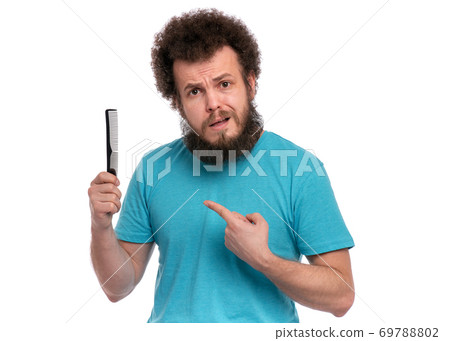 Crazy bearded man with hairbrush Crazy bearded man with hairbrush 69788802