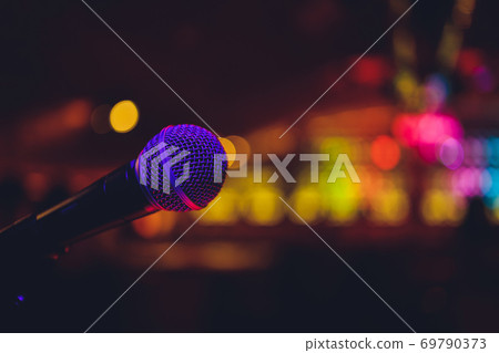 Close up of microphone in concert hall or conference room. 69790373