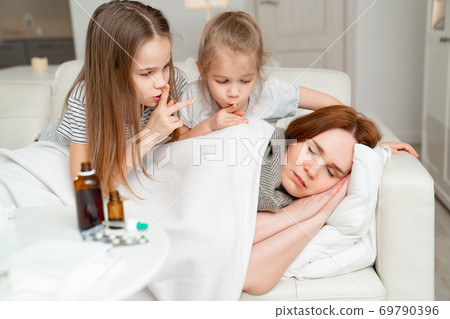 daughters do not interfere with sick mom sleep. 69790396