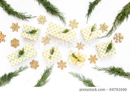 Christmas or new year texture. Christmas decorations in gold colors on white background. Holiday and celebration concept. Top view. Flat lay Christmas or new year texture. Christmas decorations in gold colors on white background. Holiday and celebration concept. Top view. Flat lay 69791690