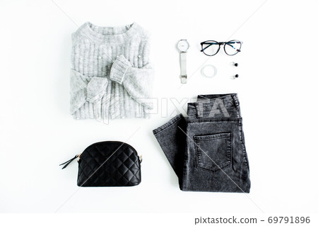 Women fashion clothes and accessories. Feminine youth collage top view. Flat lay female style look with warm sweater, jeans, glasses. Top view. 69791896