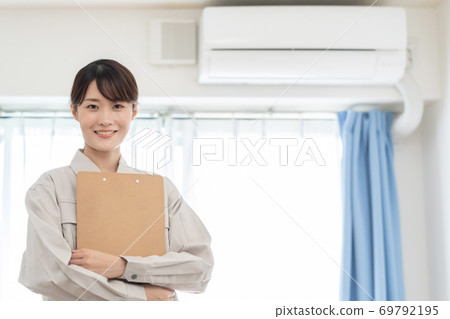 Air conditioner woman Air conditioner woman 69792195