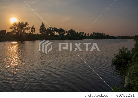 Arakawa at sunset, evening view, Chichibu mountain range falling sunset Arakawa at sunset, evening view, Chichibu mountain range falling sunset 69792251