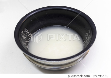 White rice soaked in water White rice soaked in water 69793580