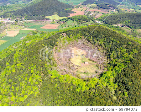 The Santa Margarida Volcano is an extinct volcano in the comarca of Garrotxa, Catalonia, Spain. The Santa Margarida Volcano is an extinct volcano in the comarca of Garrotxa, Catalonia, Spain. 69794072