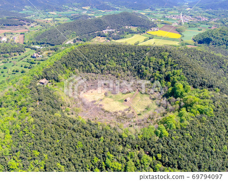 The Santa Margarida Volcano is an extinct volcano in the comarca of Garrotxa, Catalonia, Spain. The Santa Margarida Volcano is an extinct volcano in the comarca of Garrotxa, Catalonia, Spain. 69794097