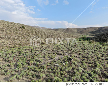 Old wood ranch in the middle of the desert valley Old wood ranch in the middle of the desert valley 69794099