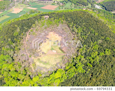 The Santa Margarida Volcano is an extinct volcano in the comarca of Garrotxa, Catalonia, Spain.  69794331