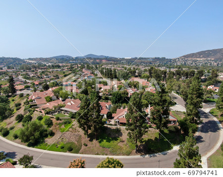 Aerial view of middle class neighborhood with residential house community, South California 69794741