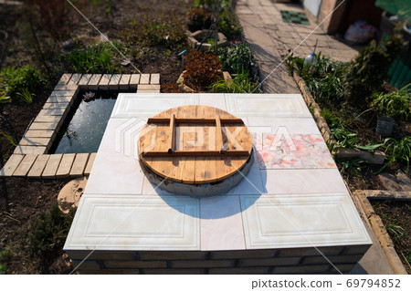 aboveground large brick tandir oven in the garden. 69794852