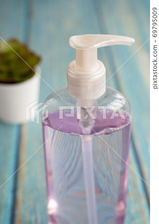 bottle of gel alcohol and pots of succulents bottle of gel alcohol and pots of succulents 69795009
