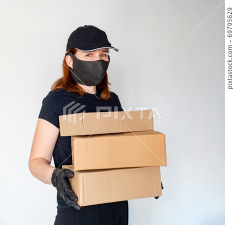 woman Delivery person holding boxes 69795629