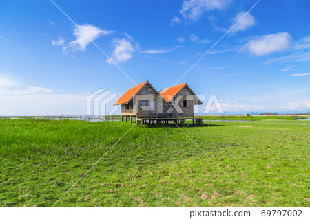 Twin old house on wetland at Talay Noi lake at Thailand. Twin old house on wetland at Talay Noi lake at Thailand. 69797002