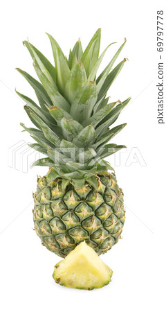 Whole pineapple and pineapple slice isolated on white background 69797778