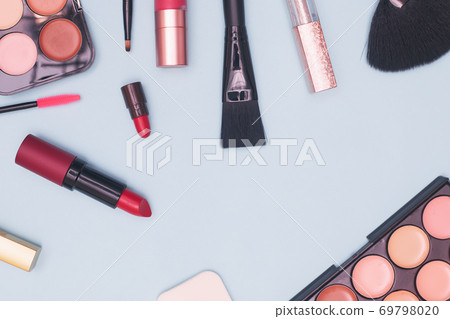 set of professional cosmetics, makeup tools and accessories on blue background, concept of beauty, fashion, shopping, flat lay 69798020