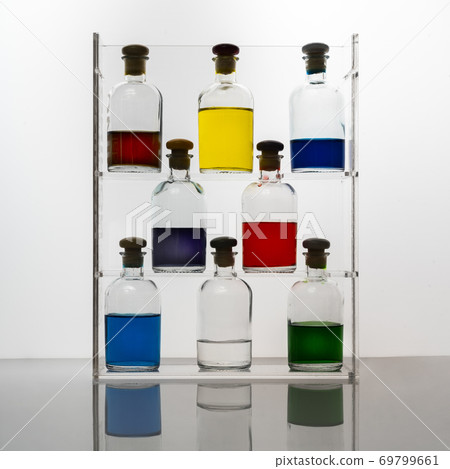 Bottles with colored liquid Bottles with colored liquid 69799661