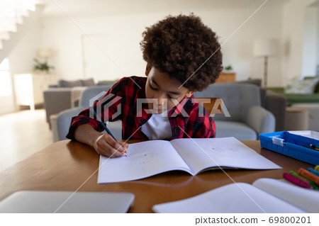 Boy doing homework at home 69800201