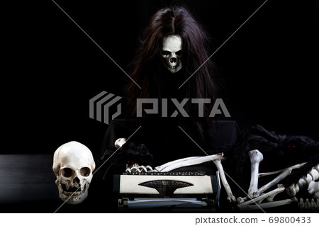 halloween of human skull with hair use Thai language typewriter on black background halloween of human skull with hair use Thai language typewriter on black background 69800433