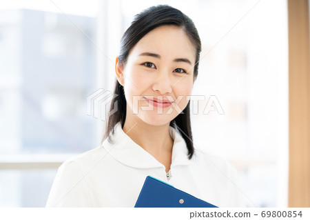 A smiling female nurse [portrait] 69800854