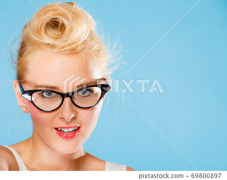 Retro pin up woman wearing eyeglasses. 69800897