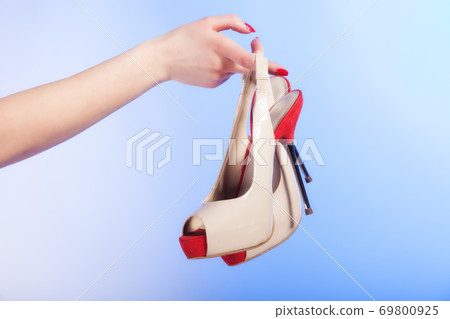 female shoes high heels in woman hand. Shopping. female shoes high heels in woman hand. Shopping. 69800925