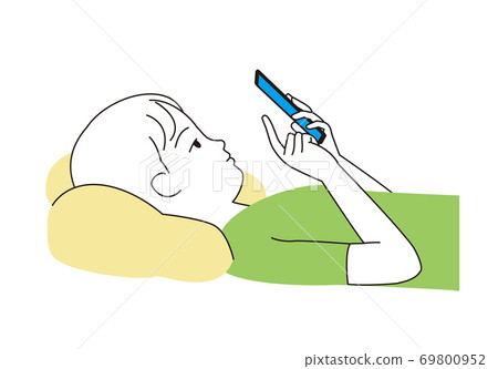 A boy looking at his smartphone on his back 69800952