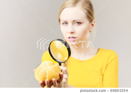 Bun bread roll and magnifying glass Bun bread roll and magnifying glass 69801054