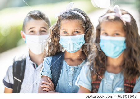 Portrait of schoolchildren with face masks during Covid-19 quarantine 69801608