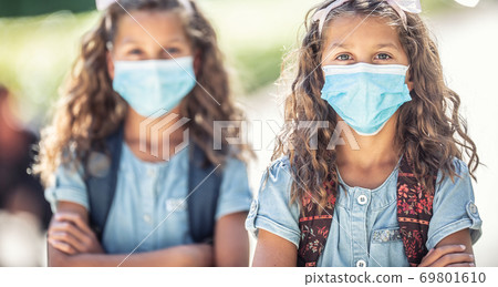 Portrait of schoolchildren with face masks during Covid-19 quarantine Portrait of schoolchildren with face masks during Covid-19 quarantine 69801610