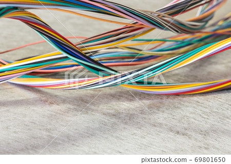 Colorful electrical cables on grunge background Colorful electrical cables on grunge background 69801650
