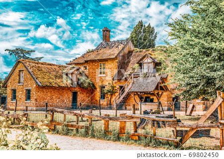 VERSAILLES, FRANCE - JULY 02, 2016 :Landscape of hamlet Queen Marie Antoinette's estate near Versailles Palace. Palace Versailles -most beautiful palace in France. 69802450