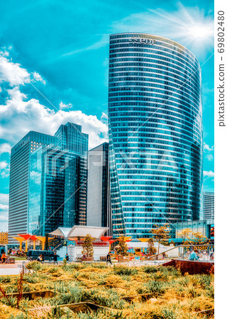 PARIS, FRANCE - JULY 06, 2016 :La Defense, Business Quarter with businessmen in the streets, area of Paris,  French financial center with skyscrapers and modern buildings. 69802480