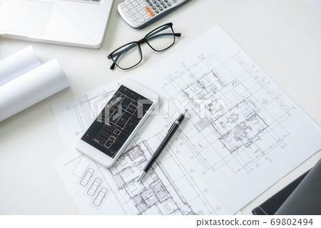 Engineering or Architect tools, blueprint and building model on table in office. Engineering or Architect tools, blueprint and building model on table in office. 69802494
