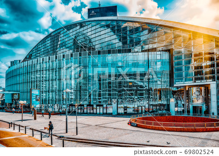 PARIS, FRANCE - JULY 06, 2016 :La Defense, Business Quarter with businessmen in the streets, area of Paris,  French financial center with skyscrapers and modern buildings. 69802524