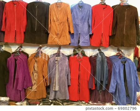 Leather jackets lined up in leather goods stores in Fez, Morocco 69802796