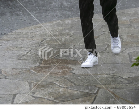 Pedestrian in the rain Pedestrian in the rain 69803654